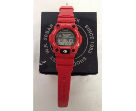 An unused boxed Casio G-shock digital red watch with another unboxed. Both in working order with moon phase, tides, time, dat