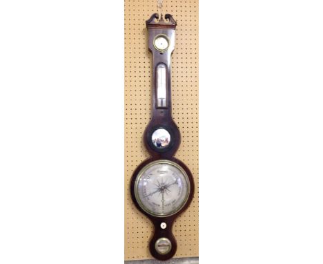 An antique mercury barometer with convex mirror insert, banding to edge & carved finial.