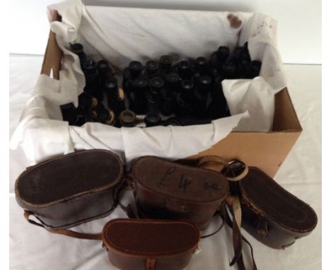A large box of vintage binoculars.
