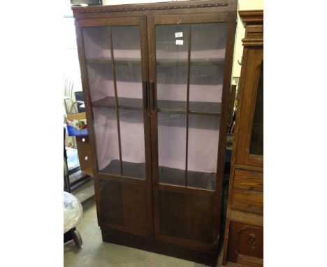 A vintage oak display cabinet.