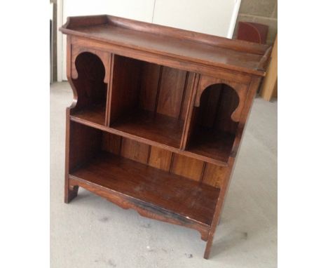 A small vintage oak bookcase.