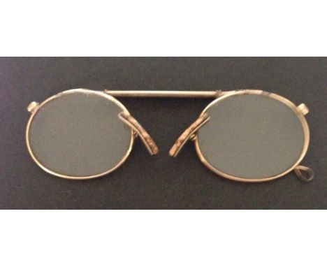 A pair of vintage gold rimmed pince nez, test as 15ct gold.