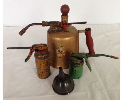 A vintage Musto garden sprayer and 3 oil cans.
