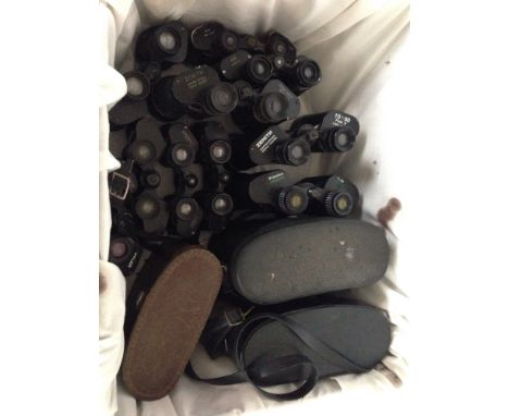 A box of vintage binoculars.