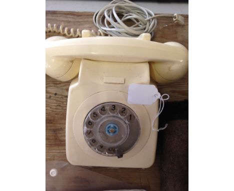A vintage cream GPO telephone with dial - adapted.