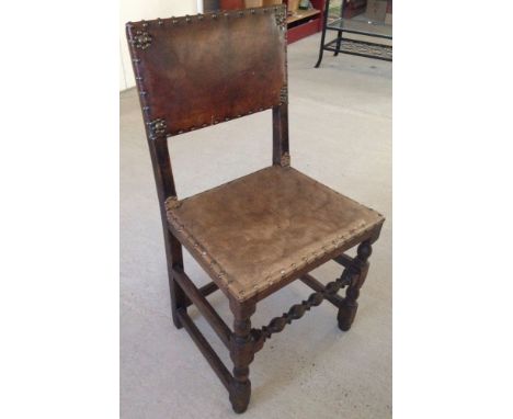 A leather upholstered vintage hall chair.