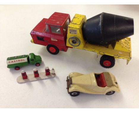 A vintage Scalex tinplate MG TF friction model car (pre Scalextric), a Tri-ang metal cement mixer, a Lesney Petrol pump & a M