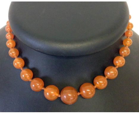A vintage 14" Cornelian necklace hand knotted with 39 round beads in graduated sizes from 5mm to 15mm diameter.