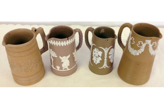3 19th century Dudson brown & white Jasperware jugs with a Copeland jug. 3 19th century Dudson brown & white Jasperware jugs with a Copeland jug.