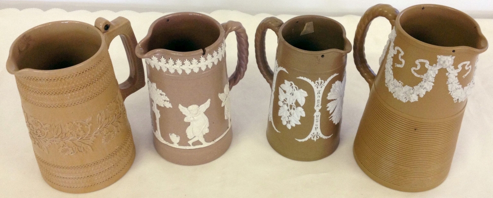 3 19th century Dudson brown & white Jasperware jugs with a Copeland jug. 3 19th century Dudson brown & white Jasperware jugs with a Copeland jug.