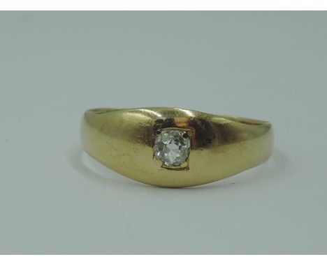 A gent's yellow metal band ring of plain form having an old cut diamond insert, approx 0.128ct, no marks, tested as 18ct gold