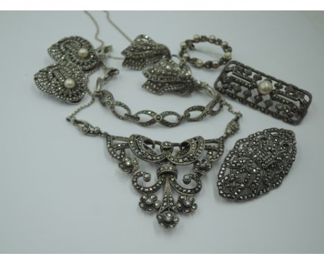 A selection of vintage marcasite jewellery, most stamped silver including a necklace on fixed chain, bracelet, collar clips e