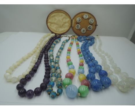 Six strings of vintage beads including mother of pearl, multi coloured glass etc and a cased set of six dress shirt buttons a