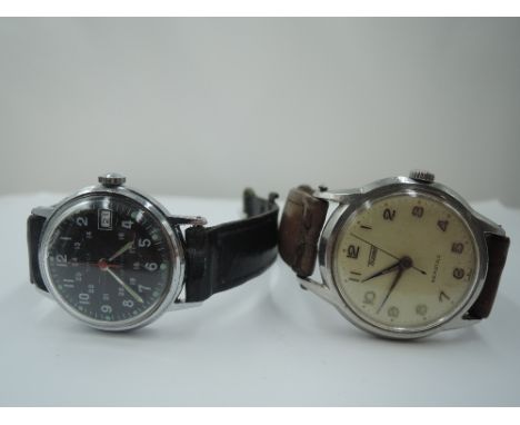 A vintage Tissot Seastar wrist watch having Arabic numeral dial, steel case and leather strap, and a vintage Timex military s