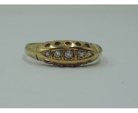 A lady's dress ring having five graduated diamond chips in a gallery mount on an 18ct gold loop, size N