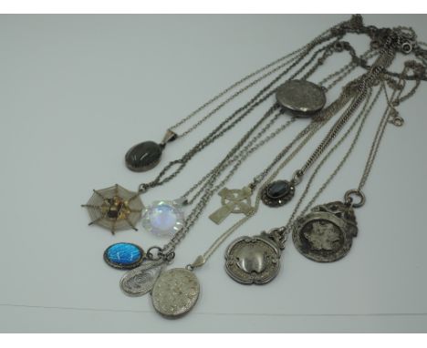 A selection of HM silver and white metal pendants stamped 925/sterling including agate, lockets, crystal, spiders web, Celtic