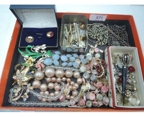 A small selection of vintage costume jewellery including brooches, watch chains, clip earrings, tie clips, rolled gold glasse