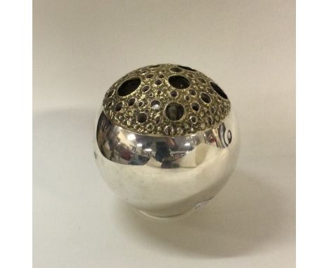 STUART DEVLIN: A novelty silver box with gilt decoration to textured cover. London 1972. Approx. 195 grams. Est. £300 - £400.