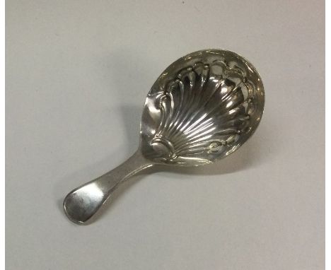 A George III silver caddy spoon with fluted bowl. Sheffield. Approx. 9 grams. Est. £30 - £50.