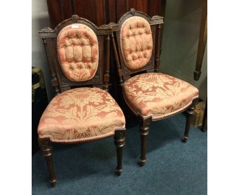 A pair of Victorian button back chairs.