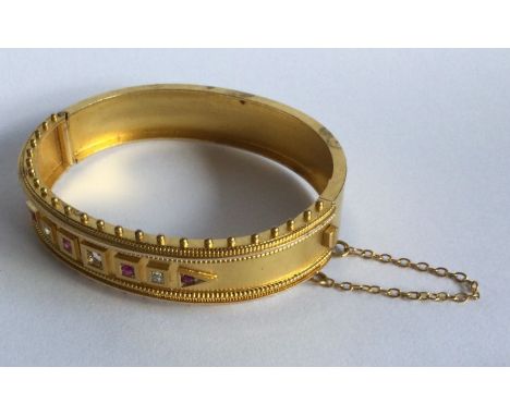 A good Victorian 15 carat gold ruby and diamond bracelet with concealed clasp. (Central stone missing). Approx. 22 grams. Est