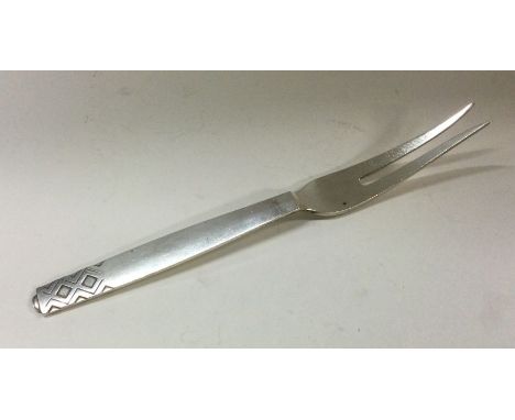 GEORG JENSEN: A heavy Danish silver fork. Approx. 71 grams. Est. £80 - £120.