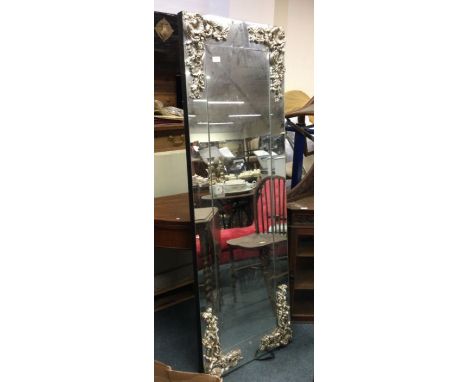 A large gilt dressing mirror.