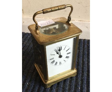 An old brass carriage clock with striking movement.
