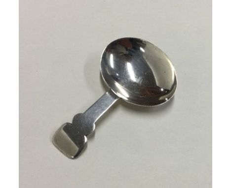 An unusual Georgian silver shaped caddy spoon. London. By TJ. Approx. 11 grams. Est. £30 - £40.