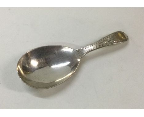 HESTER BATEMAN: A George III silver caddy spoon with engraved handle. London 1787. Approx. 9 grams. Est. £50 - £80.