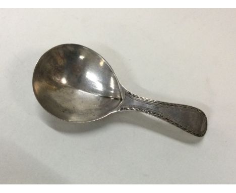 HESTER BATEMAN: A George III silver caddy spoon with engraved handle. London 1787. Approx. 9 grams. Est. £50 - £80.