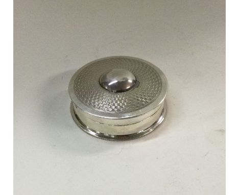 A good quality engine turned silver box with hinged top. London 1907. By WH. Approx. 24 grams. Est. £25 - £30.