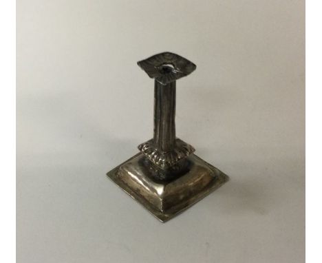 A small Queen Anne silver toy taper stick. Marked to body. Approx. 10 grams. est. £250 - £350.