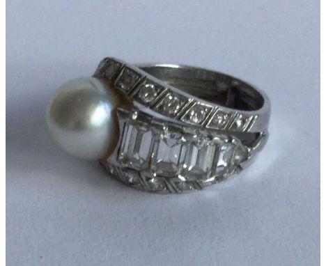 A large Art Deco pearl and diamond cocktail ring with tapering baguette cut stones. Approx. 7 grams. Est. £500 - £800.