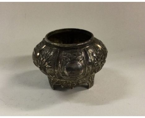 A panelled Chinese silver bowl on feet. Marked to base. Approx. 31 grams. Est. £50 - £80.