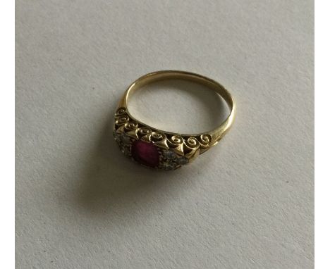 A good ruby and diamond cluster ring in 18 carat gold setting. Approx. 3 grams. Est. £200 - £300.