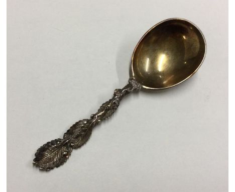 A fine quality Victorian silver gilt caddy spoon with floral decoration. London. By RS. Approx. 23 grams. Est. £60 - £80.