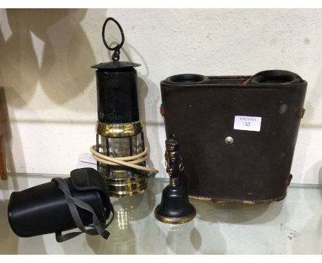 An old minors lamp together with binoculars etc.