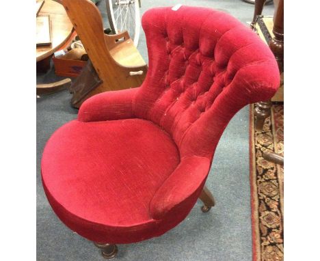 A red button back chair.