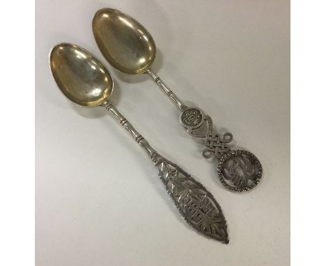 Two 19th Century Chinese silver spoons. Approx. 32 grams. Est. £30 - £50.