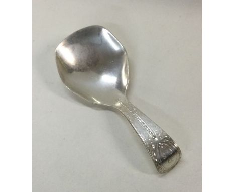 A George III bright cut silver caddy spoon. London. By Richard Crossley. Est. £50 - £80.