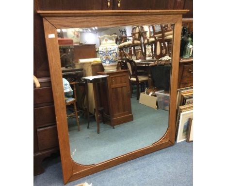 An oak overmantle mirror.