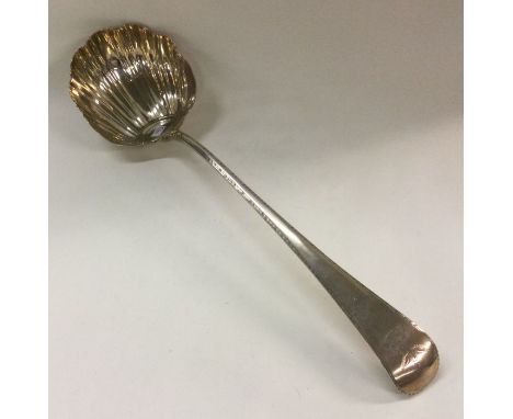 A George III silver soup ladle with crested terminal. London 1767. By RH. Approx. 199 grams. Est. £180 - £220.