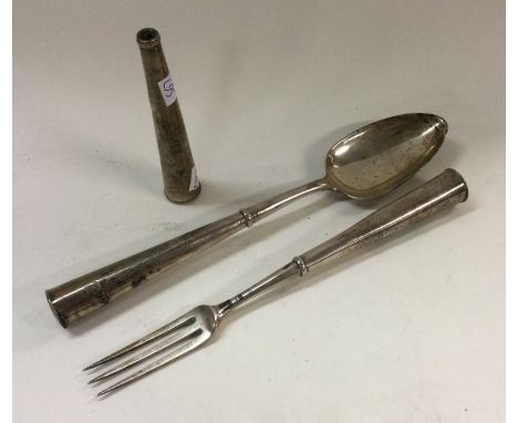 A novelty travelling spoon and fork of tapering form. Approx. 143 grams. Est. £40 - £60.