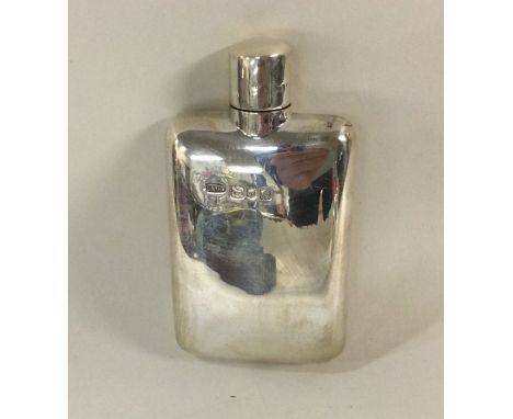 A silver flask with screw-on lid. London 1909. By George Adams. Approx. 63 grams. Est. £120 - £150.