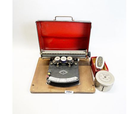An early cased Frolio no. 5 typewriter, W. 30cm, together with two bank savings boxes.