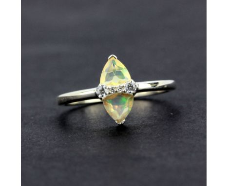 A 925 silver ring set with a marquise cut opal and white stones, (O).