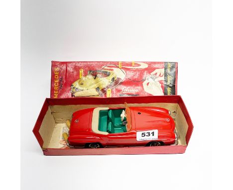 A boxed Schuco 2095 clockwork racing car, L. 21cm.