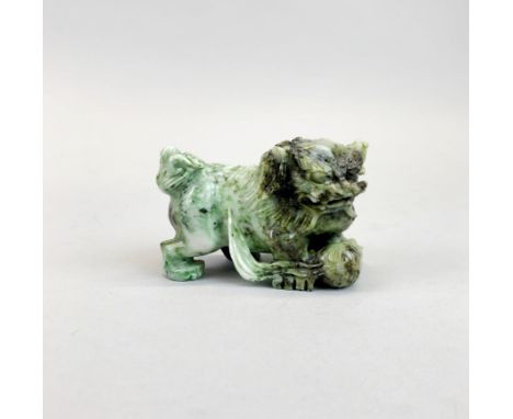 A finely carved Chinese jade figure of a lion dog, L. 9.5cm. H. 7cm.