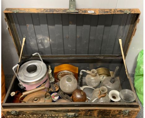 A tin trunk and contents.